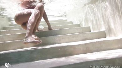 Underwater erotic fingering
