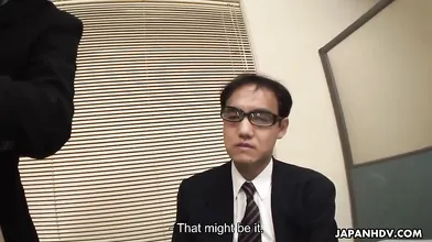 Shino Nakamura is sitting in the director\'s lap during a meeting.