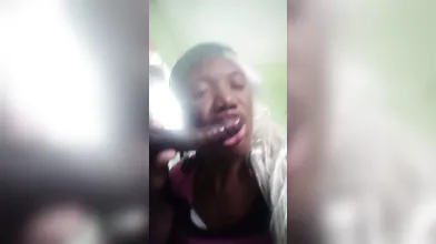 Sucking on a 10inches chocolate dick