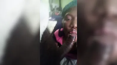 Sucking on a 10inches chocolate dick