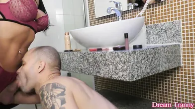 Sexy Transsexual Bianca Reis Applies Her Makeup While a Guy Sucks Her Cock
