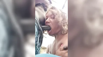 Sucking on Charles 10 inches chocolate dick