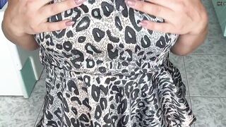 Horny wife squeezing her boobs in leopard dress