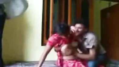 Indian couple enjoying in a hotel room