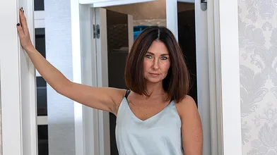 Hot MILF playing with her shaved pussy