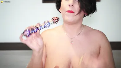 Sexy mom sticks her toy deep into her wet pussy