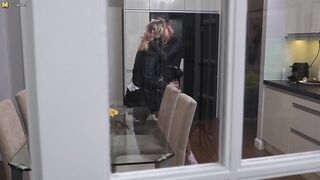 Hot babe getting fucked with a strapon by a lesbian MILF