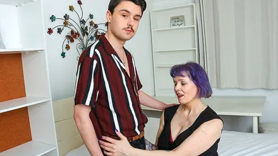 Big breasted mature lady having fun with her toy boy