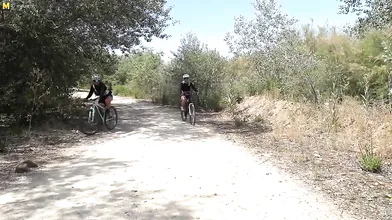 Two hot big breasted MILFs ssuck and fuck a younger biker in the open air