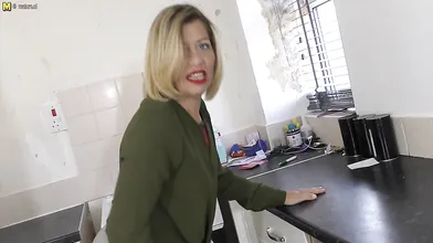 Naughty housewife playing with her wet pussy on the kitchen counter