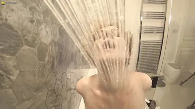 Steamy MILF with big tits playing in the bathroom