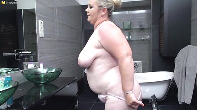 Curvy mature lady playing with her toy