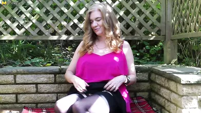 Naughty British cougar playing in the garden