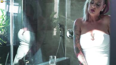 kinky MILF playing with herself in the shower