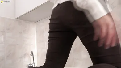 Hairy housewife getting wet in her kitchen