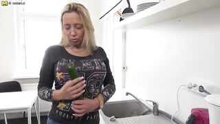 Naughty German mom playing with a cucumber