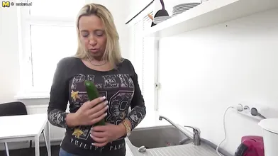 Naughty German mom playing with a cucumber