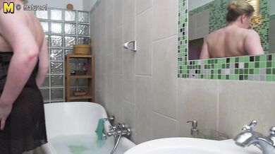 Curvy mature lady taking a naughty bath