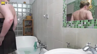 Curvy mature lady taking a naughty bath