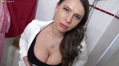 Big breasted German MILF having fun in the bathroom