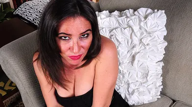 Naughty American mom masturbating on the couch