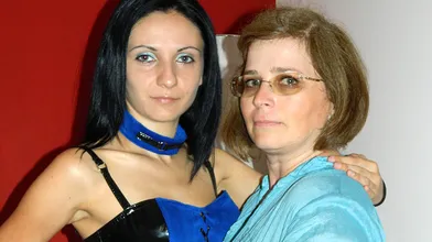 Kinky babe fucking a mature lesbian with a strapon