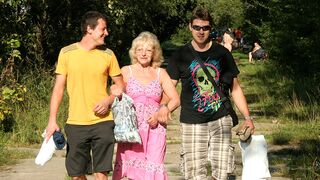 This naughty mature slut does two guys at once