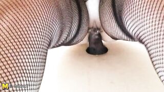 Big titted mama fucking a black cock through a hole