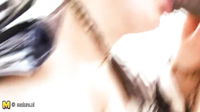 Big titted mama fucking a black cock through a hole
