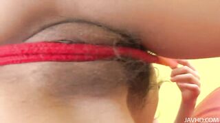 Suzuka plays with her sweet pussy with a red nylon rope as she moans and groans