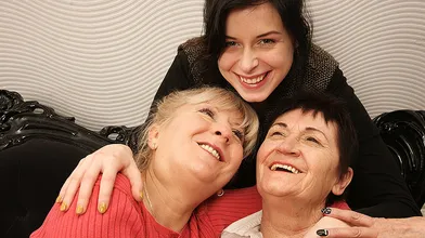 Two mature lesbians pleasing a hot young lesbian babe
