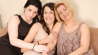 Three old and young lesbians make out on the couch