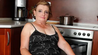 Naughty mature lady playing in the kitchen