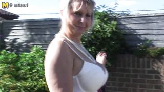 Big breasted mature slut playing in the garden