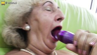 mature grandma playing with a purple dildo