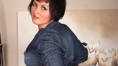 Hot hairy MILF getting herself wet on the couch