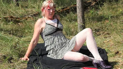 Squirting mature slut masturbating in the woods