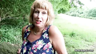 British blonde granny Rosemary plays with her pussy outdoor