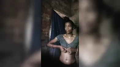 Village girl after bath wearing clothes