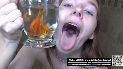 Becky feeding on fish in the shower - Vore Giantess