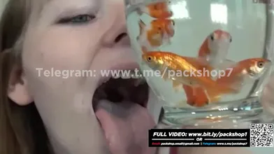 Beautiful white woman devours her fish alive - vore