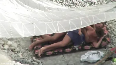 Public outdoor sex on the beach by private couple