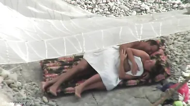 Public outdoor sex on the beach by private couple