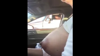 Mature Woman Touches Her Big Boob Rolling Next To A Trucks