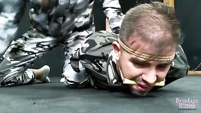 BondageKitties - (Spanish) - Military Man Hogtied And