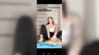 Fish lick hot girl's feet.