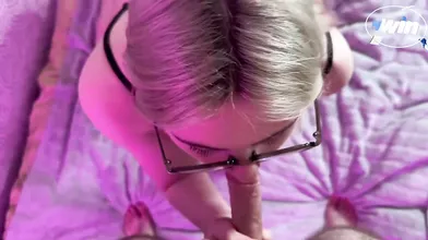 The model, a teenager in glasses, blows with spectacular legs. Blonde, providing