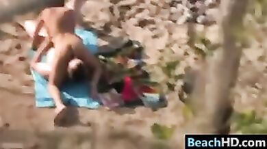 Couple Doing A 69 At The Beach