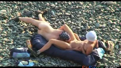 Voyeur on public beach. Oral sex