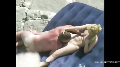 my mom and her lover on a private beach